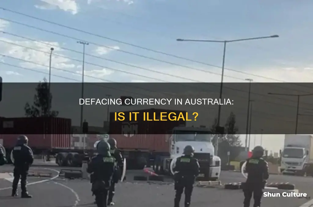 is defacing money illegal australia