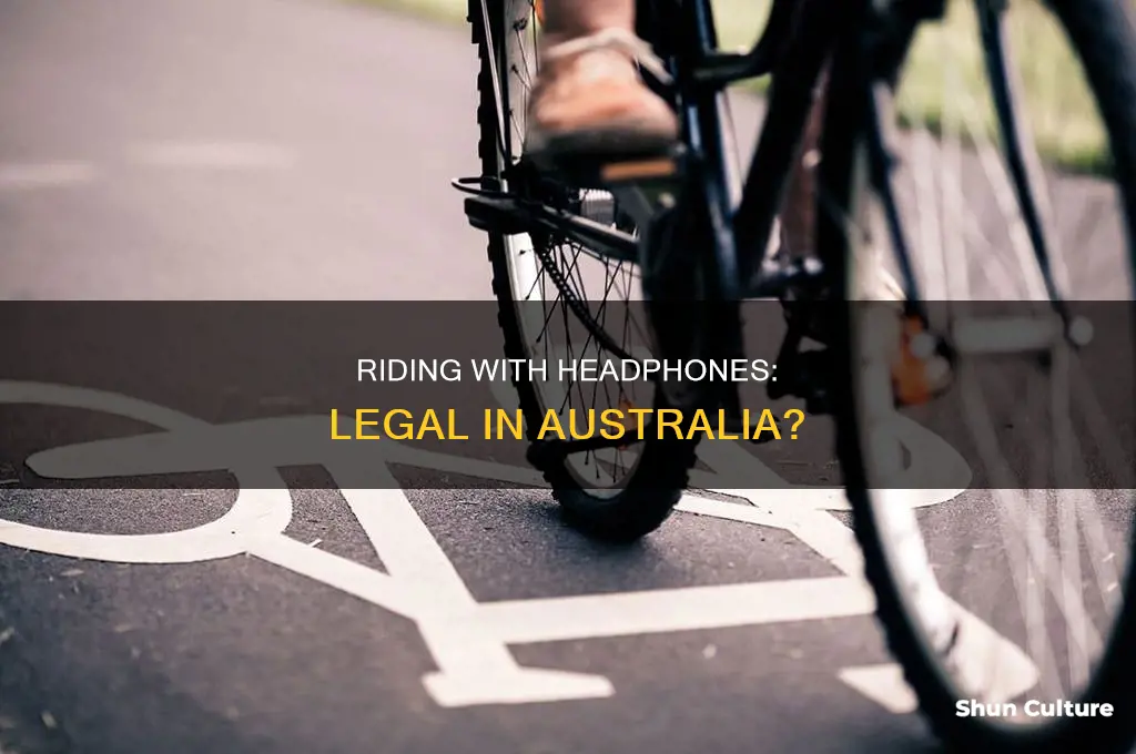 is it illegal to ride a bike with headphones australia