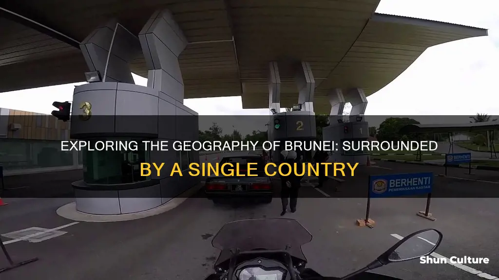 what country surrounds brunei on three sides