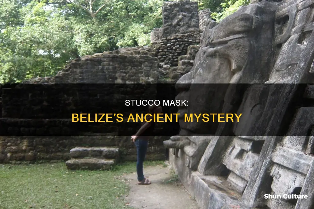 what ruin in belize has a stucco mask